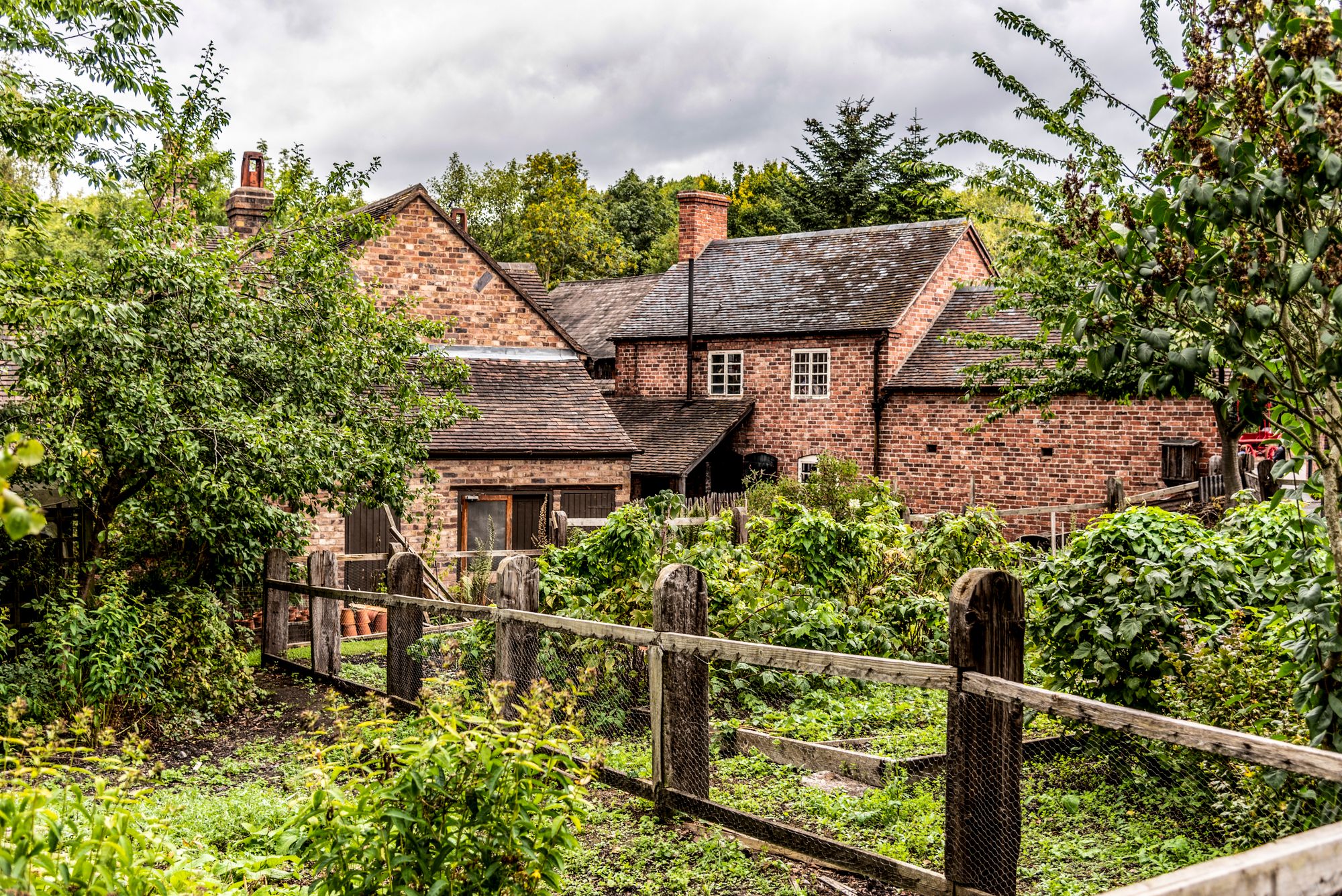 Illustrative photograph of an English brick home and garden
